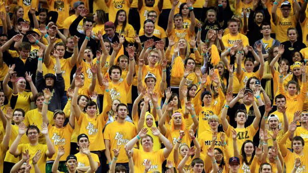 Missouri basketball fans cheering during a home game.