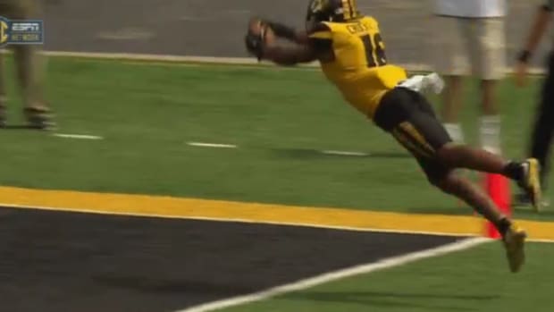 Missouri player dives for touchdown.