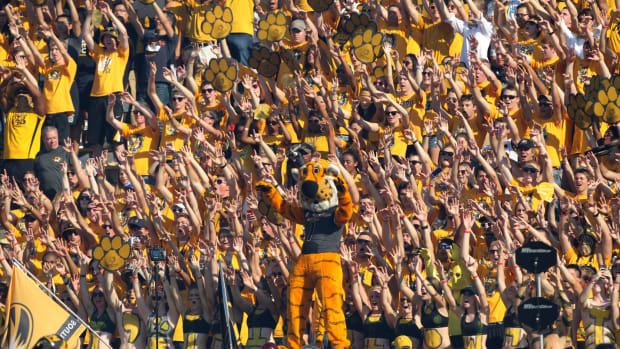 Missouri's football mascot cheering with the fans.