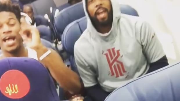 Team USA basketball members seen singing on the plane.