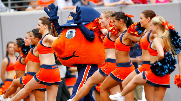 Syracuse's mascot performing with the cheerleaders.
