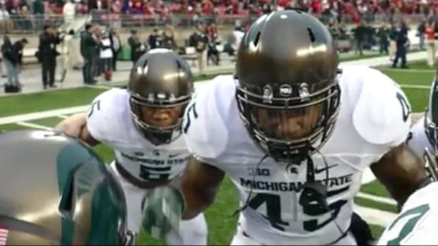 Michigan State players huddle up before game against Penn State.