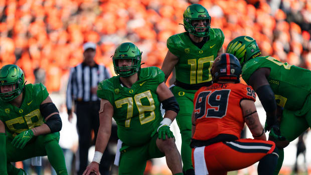 CORVALLIS, OR - NOVEMBER 26:  Offensive lineman Alex Forsyth #78  and quarterback Bo Nix #10 of the Oregon Ducks stand at the line of scrimmage during the first half of the game against the Oregon State Beavers at Reser Stadium on November 26, 2022 in Corvallis, Oregon. (Photo by Ali Gradischer/Getty Images)