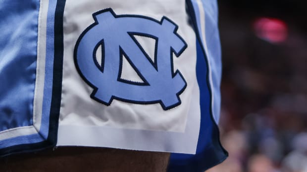 A closeup image of the North Carolina logo on a pair of shorts.