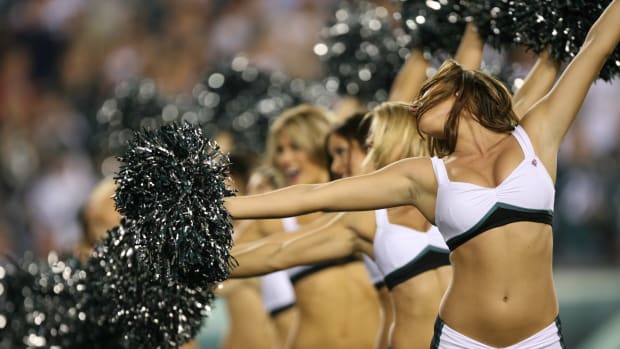 Philadelphia Eagles cheerleaders on the field during a game against the Packers.