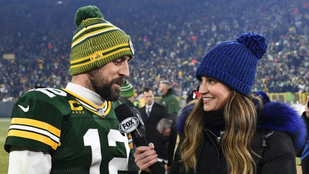 GREEN BAY, WISCONSIN - JANUARY 12:  Aaron Rodgers #12 of the Green Bay Packers speaks with Erin Andrews following a victory over the Seattle Seahawks in the NFC Divisional Playoff game at Lambeau Field on January 12, 2020 in Green Bay, Wisconsin. (Photo by Stacy Revere/Getty Images)