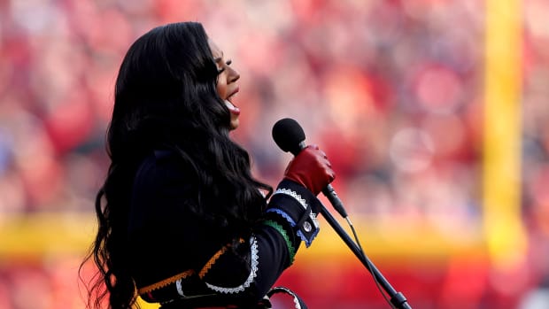 KANSAS CITY, MISSOURI - JANUARY 30: Grammy Award-winning singer-songwriter, actor and author Ashanti sings the national anthem prior to the start of the AFC Championship Game between the Kansas City Chiefs and Cincinnati Bengals at Arrowhead Stadium on January 30, 2022 in Kansas City, Missouri. (Photo by Jamie Squire/Getty Images)