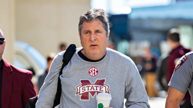 Mississippi State head football coach Mike Leach walks into a game.