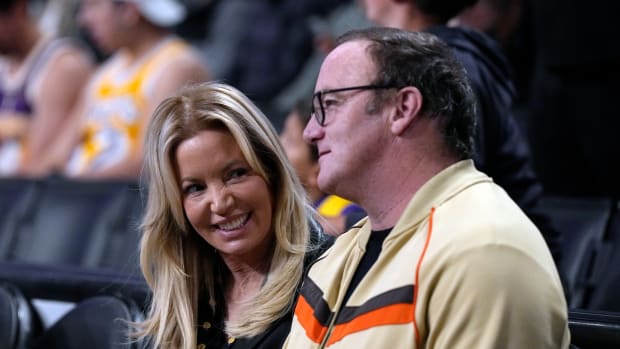 Jeanie Buss attending a game with Jay Mohr.