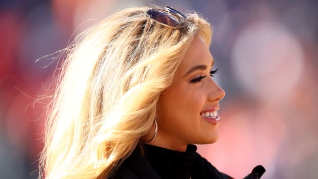 DENVER, COLORADO - DECEMBER 11: Gracie Hunt, the daughter of Kansas City Chiefs owner Clark Hunt enjoys the sidelines at Empower Field At Mile High on December 11, 2022 in Denver, Colorado. (Photo by Jamie Schwaberow/Getty Images)