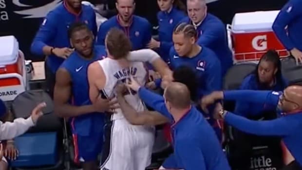 Fight breaks out during NBA game.