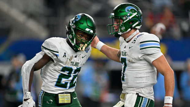 Tulane running back Tyjae Spears and quarterback Michael Pratt celebrate a touchdown against USC in the Cotton Bowl.