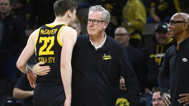 IOWA CITY, IOWA- DECEMBER 08:  Head coach Fran McCaffery of the Iowa Hawkeyes hugs his son Patrick MCaffery #22 after securing his 500th career win during the second half against the Iowa State Cyclones at Carver-Hawkeye Arena, on December 8, 2022 in Iowa City, Iowa.  (Photo by Matthew Holst/Getty Images)