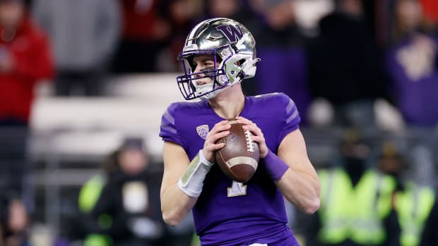 SEATTLE, WASHINGTON - NOVEMBER 26: Sam Huard #7 of the Washington Huskies looks to pass against the Washington State Cougars during the fourth quarter at Husky Stadium on November 26, 2021 in Seattle, Washington. (Photo by Steph Chambers/Getty Images)