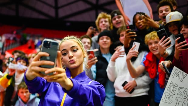 SALT LAKE CITY, UTAH - JANUARY 06: Olivia Dunne of LSU takes a 'selfie' with fans after a PAC-12 meet against Utah at Jon M. Huntsman Center on January 06, 2023 in Salt Lake City, Utah. (Photo by Alex Goodlett/Getty Images)