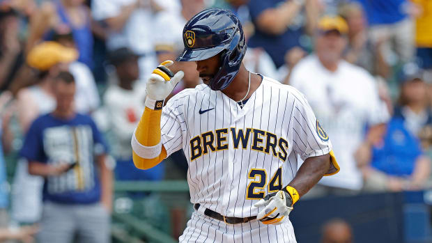 MILWAUKEE, WISCONSIN - JULY 10: Andrew McCutchen #24 of the Milwaukee Brewers tips his helmet while crossing home plate after hitting a two run homer in the ninth inning against the Pittsburgh Pirates at American Family Field on July 10, 2022 in Milwaukee, Wisconsin. (Photo by John Fisher/Getty Images)