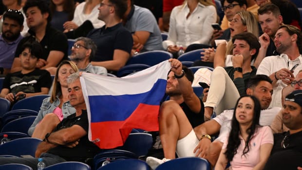 A supporter holding a Russian flag.