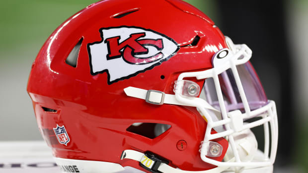 A Kansas City Chiefs helmet sits on the sideline.