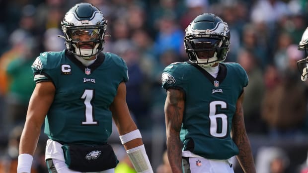 Jalen Hurts and DeVonta Smith of the Philadelphia Eagles look on against the Tennessee Titans.