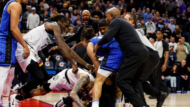 MINNEAPOLIS, MN - FEBRUARY 03: Members of the Orlando Magic and Minnesota Timberwolves get into a scrum in the third quarter of the game at Target Center on February 03, 2023 in Minneapolis, Minnesota. Mo Bamba #11, Jalen Suggs #4 of the Orlando Magic and Austin Rivers #25 of the Minnesota Timberwolves were ejected from the game. NOTE TO USER: User expressly acknowledges and agrees that, by downloading and or using this Photograph, user is consenting to the terms and conditions of the Getty Images License Agreement. (Photo by David Berding/Getty Images)
