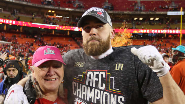 Travis Kelce poses with his mother after winning the AFC Championship in 2020.