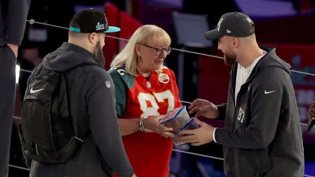 Donna Kelce on stage with her sons Travis and Jason at Super Bowl Opening Night.