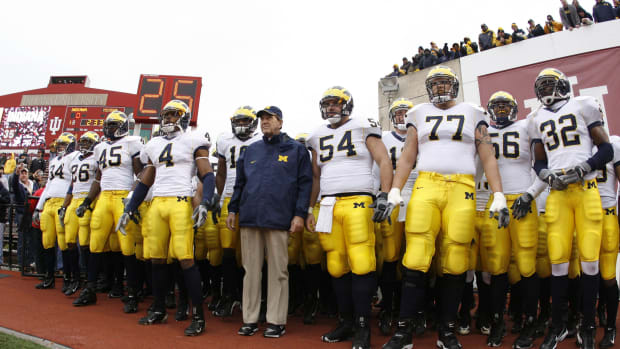 Michigan Wolverines head coach Lloyd Carr with his players before a game at Indiana.