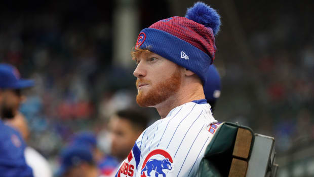 Clint Frazier sitting on the bench for the Chicago Cubs.