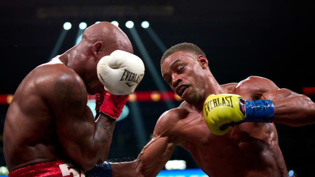 Boxer Errol Spence Jr. connects on a punch during a fight.