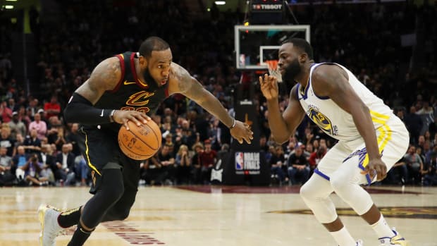 CLEVELAND, OH - JUNE 06:  LeBron James #23 of the Cleveland Cavaliers drives against Draymond Green #23 of the Golden State Warriors during Game Three of the 2018 NBA Finals at Quicken Loans Arena on June 6, 2018 in Cleveland, Ohio. NOTE TO USER: User expressly acknowledges and agrees that, by downloading and or using this photograph, User is consenting to the terms and conditions of the Getty Images License Agreement.  (Photo by Gregory Shamus/Getty Images)