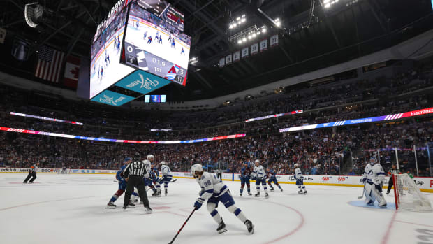DENVER, COLORADO - JUNE 18: A general view of Brandon Hagel #38 of the Tampa Bay Lightning looking to make a play with the puck after Nicholas Paul #20 of the Tampa Bay Lightning won the defensive zone face-off against Gabriel Landeskog #92 of the Colorado Avalanche in the first period of Game Two of the 2022 Stanley Cup Final at Ball Arena on June 18, 2022 in Denver, Colorado. (Photo by Dave Sandford/NHLI via Getty Images)