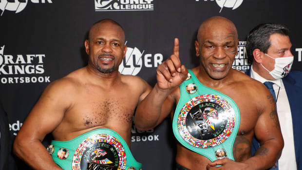 LOS ANGELES, CALIFORNIA - NOVEMBER 28: Roy Jones Jr. (L) and Mike Tyson celebrate their split draw during Mike Tyson vs Roy Jones Jr. presented by Triller at Staples Center on November 28, 2020 in Los Angeles, California. (Photo by Joe Scarnici/Getty Images for Triller)