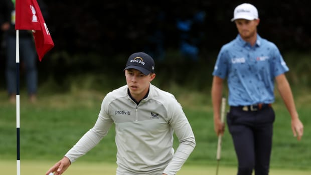 BROOKLINE, MASSACHUSETTS - JUNE 19: (L-R) Matt Fitzpatrick of England waves on the fifth green as Will Zalatoris of the United States looks on during the final round of the 122nd U.S. Open Championship at The Country Club on June 19, 2022 in Brookline, Massachusetts. (Photo by Patrick Smith/Getty Images)