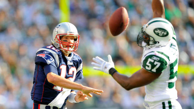 19 September 2010: New England Patriots quarterback Tom Brady (12) gets a pass blocked by New York Jets linebacker Bart Scott (57) during the first half the New England Patriots vs New York Jets game at the New Meadowlands Stadium in East Rutherford, New Jersey. (Photo by Rich Kane/Icon Sportswire via Getty Images)