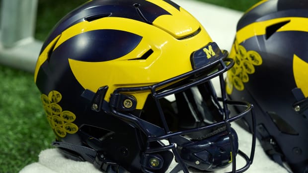 INDIANAPOLIS, IN - DECEMBER 04: A detail view of a Michigan Wolverines helmet is seen on an equipment cart during the Big Ten Championship Game between the Iowa Hawkeyes and the Michigan Wolverines on December 04, 2021, at Lucas Oil Stadium, in Indianapolis, IL. (Photo by Robin Alam/Icon Sportswire via Getty Images)