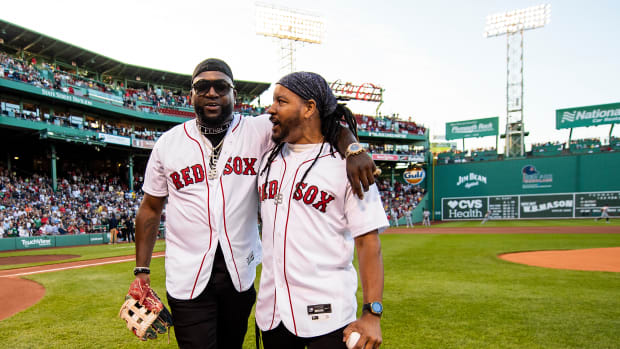 BOSTON, MA - JUNE 20: Former left fielder Manny Ramirez of the Boston Red Sox reacts with former designated hitter David Ortiz after being presented with his Boston Red Sox Hall of Fame plaque during a pre-game ceremony before a game against the Detroit Tigers on June 20, 2022 at Fenway Park in Boston, Massachusetts. (Photo by Billie Weiss/Boston Red Sox/Getty Images)