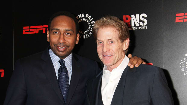 Stephen A. Smith and Skip Bayless at a 2014 Media Dinner.