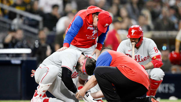 SAN DIEGO, CA - JUNE 25:  Bryce Harper #3 of the Philadelphia Phillies is looked at after being hit with a pitch during the fourth inning of a baseball game against the San Diego Padres June 25, 2022 at Petco Park in San Diego, California. (Photo by Denis Poroy/Getty Images)