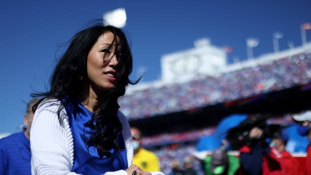 Bills owner Kim Pegula on the field during a game.