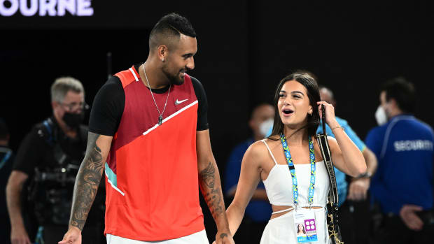 MELBOURNE, AUSTRALIA - JANUARY 29: Nick Kyrgios of Australia walks with his girlfriend Costeen Hatzi after winning his Men's Doubles Final match with Thanasi Kokkinakis of Australia against Matthew Ebden of Australia and Max Purcell of Australia during day 13 of the 2022 Australian Open at Melbourne Park on January 29, 2022 in Melbourne, Australia. (Photo by Quinn Rooney/Getty Images)