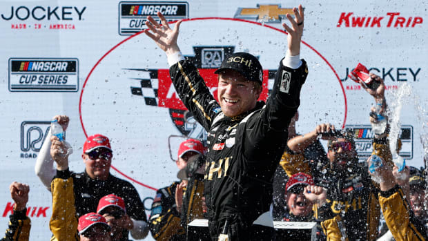 NASCAR driver celebrates winning the Kwik Trip 250.