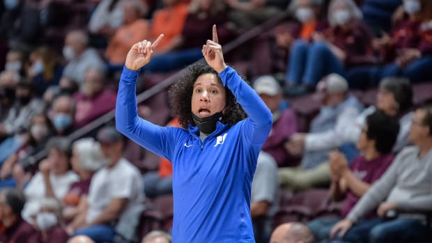 BLACKSBURG, VA - DECEMBER 30: Duke Blue Devils head coach Kara Lawson signals to her team during a college basketball game between the Duke Blue Devils and the Virginia Tech Hokies on December 30, 2021 at Cassell Coliseum in Blacksburg, VA.  (Photo by Brian Bishop/Icon Sportswire via Getty Images)