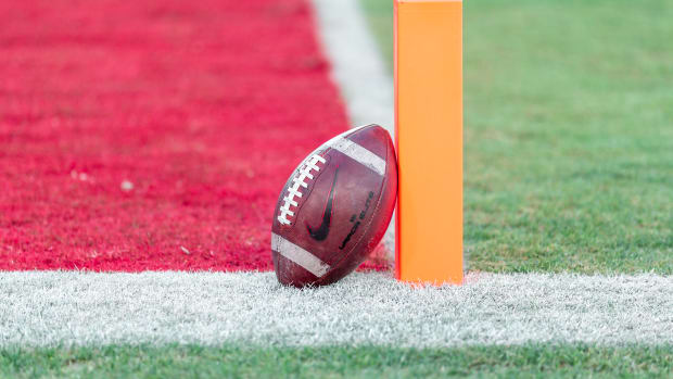 PALO ALTO, CA - NOVEMBER 27:  A close up view of an American football leaning on the goal line marker on the field at Stanford Stadium before an NCAA football game between the Notre Dame Fighting Irish and the Stanford Cardinal on November 27, 2021 in Palo Alto, California.  (Photo by David Madison/Getty Images)
