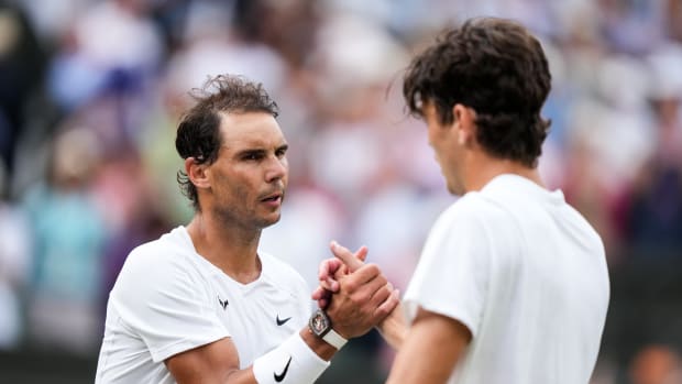 LONDON, ENGLAND - JULY 06: Rafael Nadal of Spain greets Taylor Fritz of The United States after their Men's Singles Quarter Finals Match during day ten of The Championships Wimbledon 2022 at All England Lawn Tennis and Croquet Club on July 06, 2022 in London, England. (Photo by Shi Tang/Getty Images)