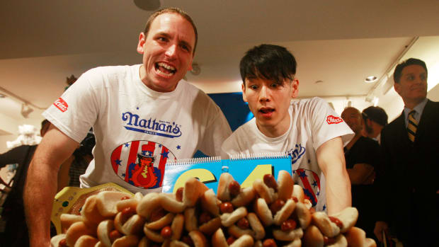 NEW YORK - JULY 02:  Former champion Takeru Kobayashi (R) and reigning champion Joey Chestnut look on at the Nathan's Famous Fourth of July International Hot Dog Eating Contest official weigh-in ceremony July 2, 2009 in New York City. Chestnut defeated arch rival Kobayashi of Japan in an overtime battle last year by consuming 64 hot dogs.  (Photo by Mario Tama/Getty Images)