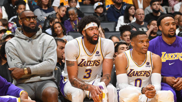 LOS ANGELES, CA - APRIL 3: LeBron James #6, Anthony Davis #3 and Russell Westbrook #0 of the Los Angeles Lakers look on/ during the game against the Denver Nuggets on April 3, 2022 at Crypto.Com Arena in Los Angeles, California. NOTE TO USER: User expressly acknowledges and agrees that, by downloading and/or using this Photograph, user is consenting to the terms and conditions of the Getty Images License Agreement. Mandatory Copyright Notice: Copyright 2022 NBAE (Photo by Andrew D. Bernstein/NBAE via Getty Images)