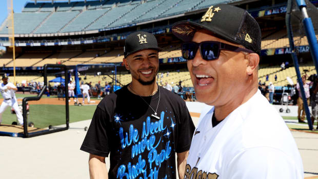 LOS ANGELES, CALIFORNIA - JULY 19: Mookie Betts #50 of the Los Angeles Dodgers speaks with manager Dave Roberts during batting practice ahead of the 92nd MLB All-Star Game presented by Mastercard at Dodger Stadium on July 19, 2022 in Los Angeles, California. (Photo by Sean M. Haffey/Getty Images)