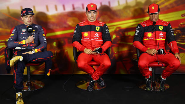 BARCELONA, SPAIN - MAY 21: Pole position qualifier Charles Leclerc of Monaco and Ferrari (C), Second placed qualifier Max Verstappen of the Netherlands and Oracle Red Bull Racing (L) and Third placed qualifier Carlos Sainz of Spain and Ferrari (R) talk in the press conference after qualifying ahead of the F1 Grand Prix of Spain at Circuit de Barcelona-Catalunya on May 21, 2022 in Barcelona, Spain. (Photo by Dan Istitene - Formula 1/Formula 1 via Getty Images)