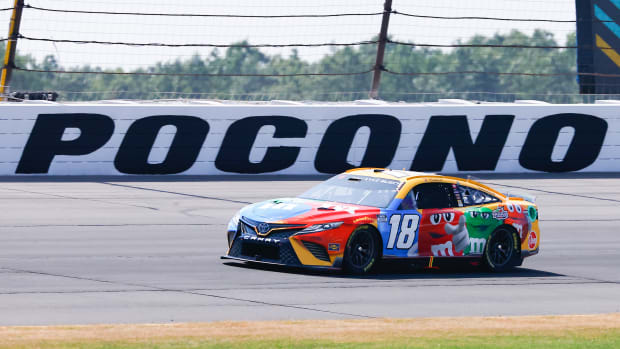 LONG POND, PA - JULY 24:  Kyle Busch (#18 Joe Gibbs Racing M&M's Toyota) drives during the NASCAR Cup Series M&MS Fan Appreciation 400 on July 24, 2022 at Pocono Raceway in Long Pond, Pennsylvania.   (Photo by Rich Graessle/Icon Sportswire via Getty Images)