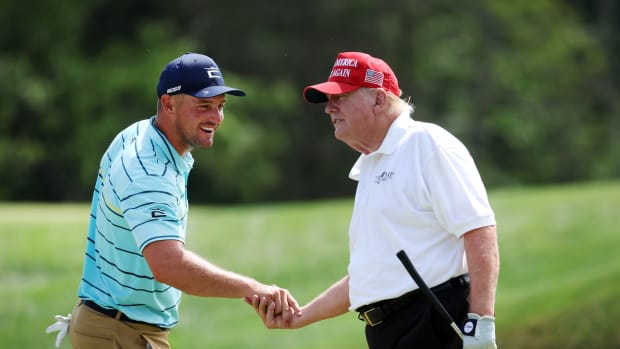 BEDMINSTER, NEW JERSEY - JULY 28: (L-R) Team Captain Bryson DeChambeau of Crushers GC interacts with former U.S. President Donald Trump on the fourth hole during the pro-am prior to the LIV Golf Invitational - Bedminster at Trump National Golf Club Bedminster on July 28, 2022 in Bedminster, New Jersey. (Photo by Jonathan Ferrey/LIV Golf via Getty Images)
